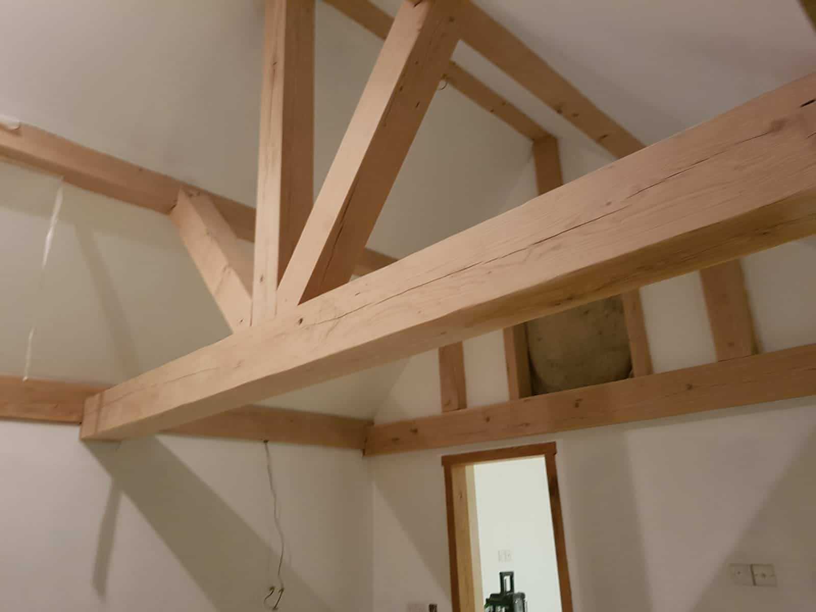 Timber roof beams support